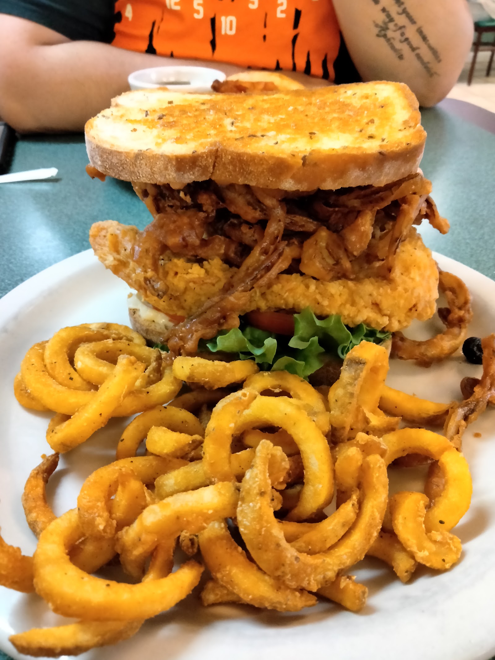 Loaded sandwich tower with curly fries